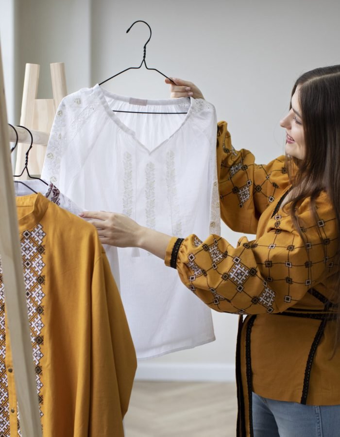 medium-shot-woman-looking-ukranian-shirt