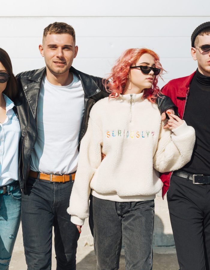 young-people-hugging-walking-street-together